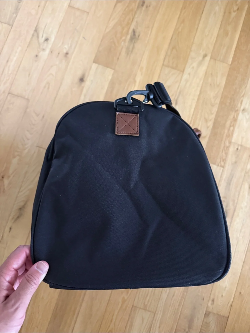 Herschel Supply Company Black Duffel with Brown Straps and White Piping. 43L.